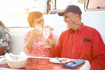 couple drinking wine at sunset
